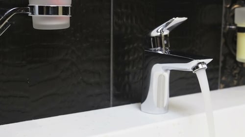 Water Faucet in a Luxurious Hotel Room or at Home