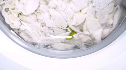 Washing Machine Washes White Clothing and Sheets