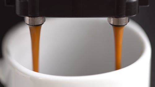 Coffee Machine Making Coffee in White Mug