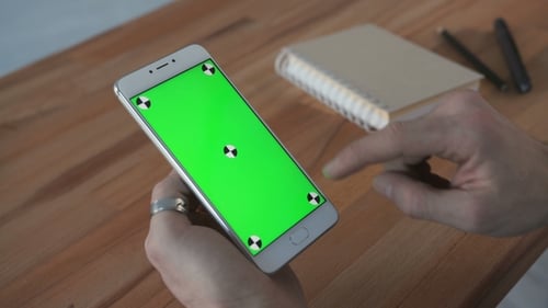 Man Using Phone with Green Screen Hold in Hands