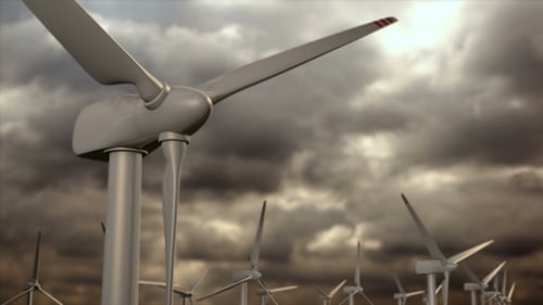 Parque de generadores eólicos contra un cielo de tormenta