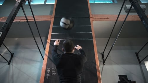 Athlete Training with Heavy Weight Ball