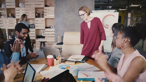 Multiethnic Employees Welcome Female Team Leader. Young Happy European Businesswoman Leads Office