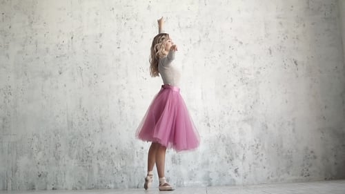 Beautiful Woman Ballet Dancing Gracefully in Studio