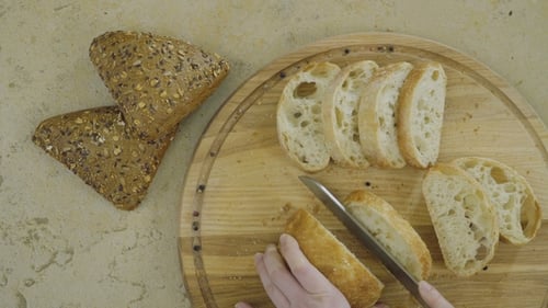 Cutting Bread Loaf on a Cutting Board