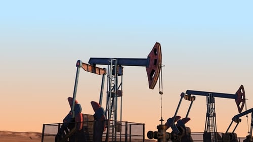 Industrial Oil Pumpjacks Pumping Energy at Sunset