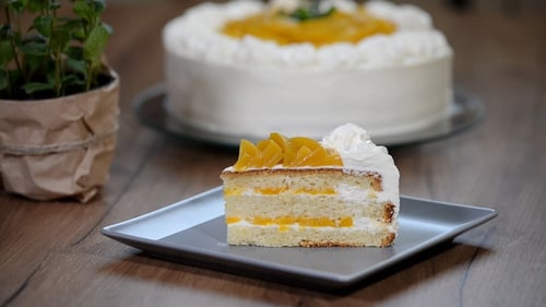 Fork Takes Bite of Cake Slice