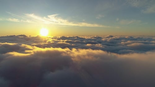Aerial View of Majestic Clouds at Sunrise