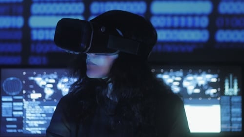 Woman Uses VR Headset in a Futuristic Office