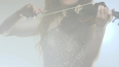 Woman Plays Violin with Skill and Passion