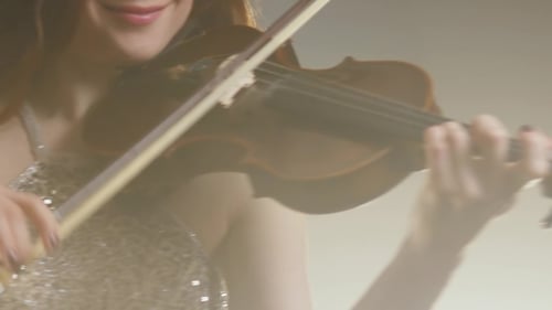 Woman Playing Violin in Studio