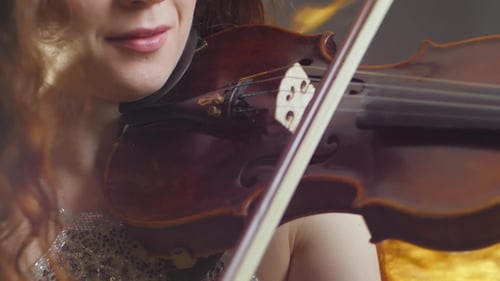Violinist Performing Music on Vintage Violin