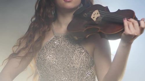 Violinist Plays Violin in Smoky Room