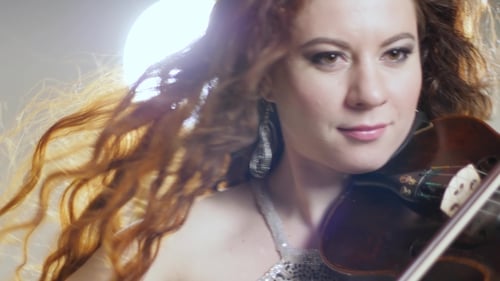 Woman Playing Violin with Flowing Red Hair