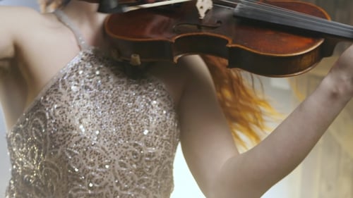 Elegant Woman Playing Violin Beautifully