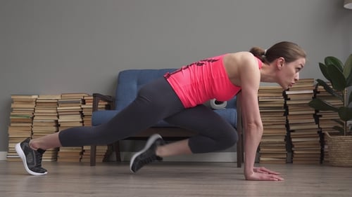 Fitness Woman Doing Mountain Climber Running Workout at Home