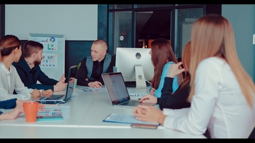 Senior Executive Director Explains the Company To His Employees in the Office