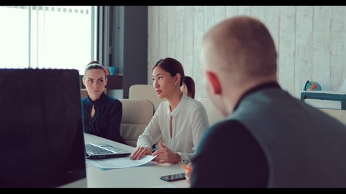 Business Team Discussing Ideas in Modern Office