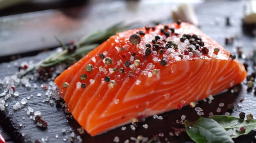 Fresh Raw Salmon Seasoned with Salt and Pepper