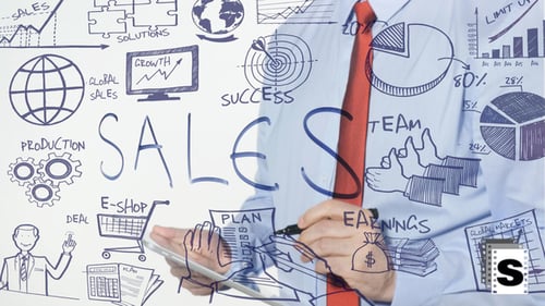 Man Writing Business Plan on Glass Surface