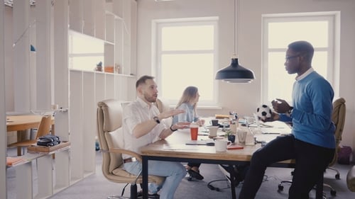 Camera Moves Backwards in Trendy Modern Office. Happy Multiethnic Business People Collaborate in