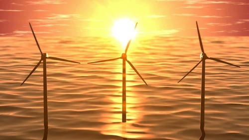Generadores de viento en el océano al atardecer