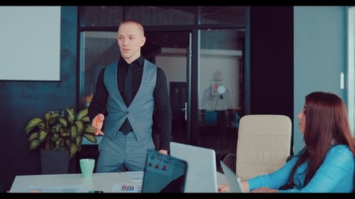 Director Is Standing Near the Table in the Office Sharing Business Ideas with Colleagues