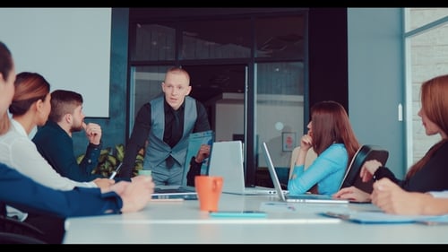 Director and His Business Associates Discuss the Company in the Office