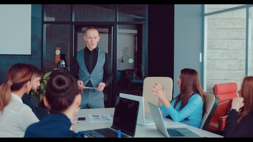 Handsome Young Director Communicates with Business Colleagues in a Modern Office