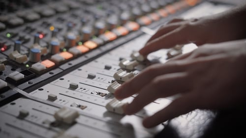 Shot of Professional Dj's Hands Working with a Recording Board in Studio