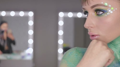 Blonde Model with Colorful Body Paint and Rhinestones