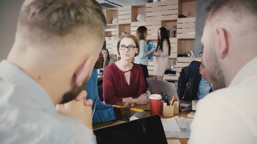 Team Brainstorming in Trendy Loft Modern Office. Young Multiethnic Creative Smiling Employees