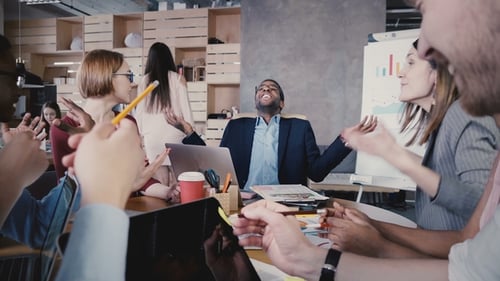 Happy Multiethnic People Collaborating in Office. Young Smiling Business Partners Brainstorming