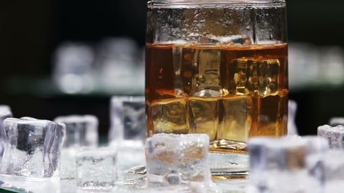 Whiskey in a Glass of Ice on a Black Background