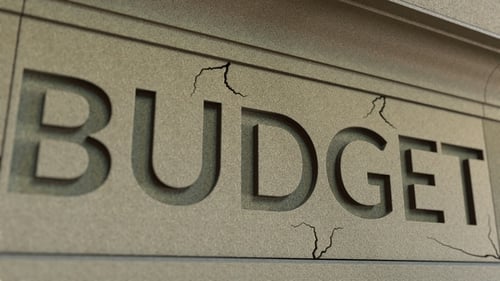 Cracking BUDGET Word on the Stone Facade
