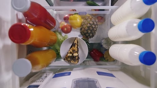 Filling Refrigerator with Food and Drinks