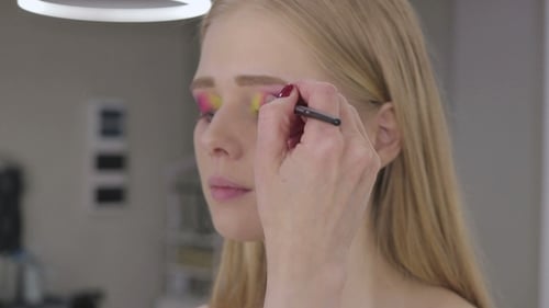 Woman Getting Eyebrow Makeup Applied With Brush