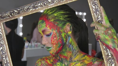 Woman Posing with Colorful Body Paint and Frame