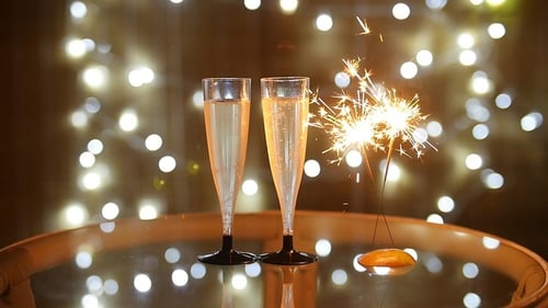 Sparkling Champagne with Lit Sparkler Celebration at Night