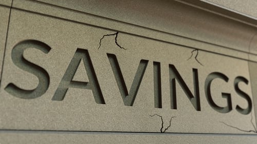 Cracking SAVINGS Word on the Stone Facade