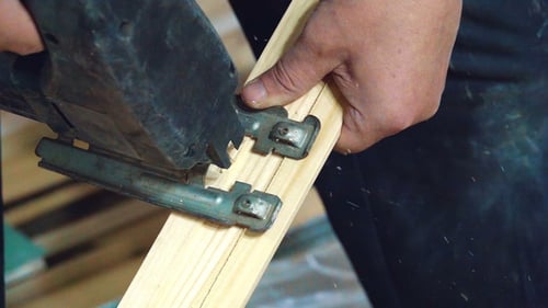 of Electric Jigsaw in Action, Cutting Board