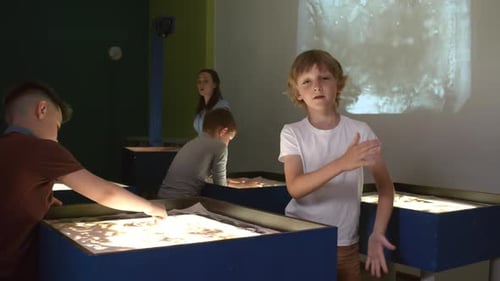 Children Learning at an Interactive Sand Exhibit