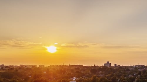 Sunset Time-Lapse Over Urban Skyline