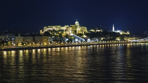 Panorama of Budapest at Night, Hungary. Beautifully Lit Bridges, Ships Sail Along the Danube