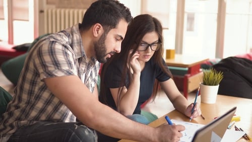 Young Adults Working on Laptop Together