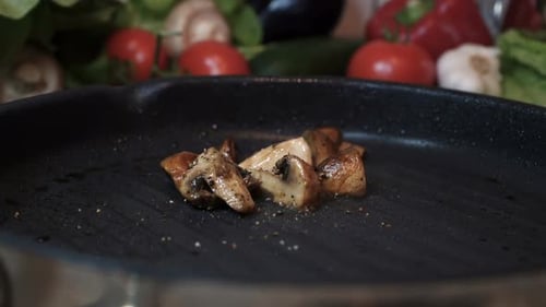 Mushrooms Cooking in a Pan with Oil