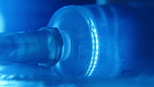 Crystalline Water Is Squeezed Out From a Syringe on a Glassy Surface in a Lab