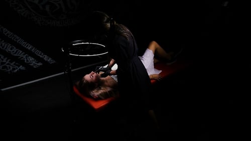 Top View. Beauty and Sexy Female Client. Professional Specialist of Permanent Make-up Work in Black