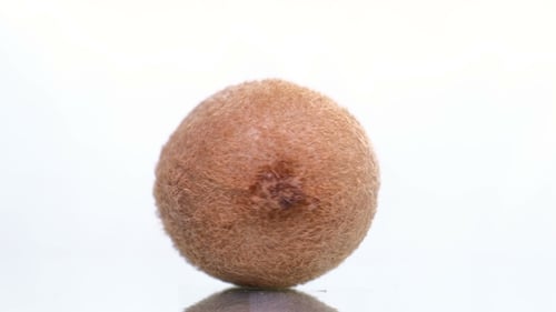 Rotating Kiwi Fruit Close Up on White Background