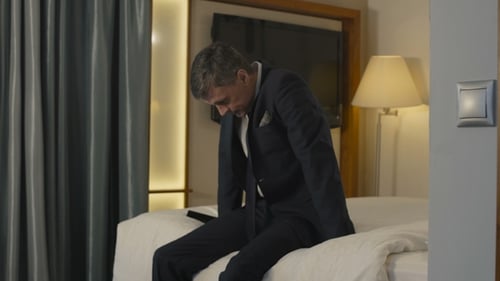 Businessman Checking in Hotel Room During Trip